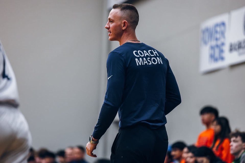 Coach Elliot Mason playing basketball